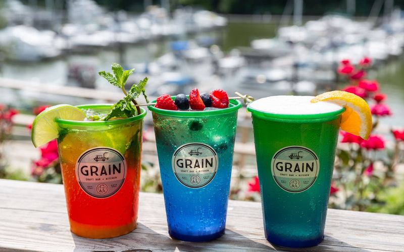 Three Grain cocktails on the H2O rail with the marina behind